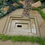 The rill in the Yorkshire garden terminated in a sleek contemporary water feature