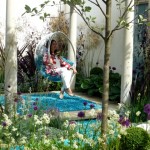 rachel de thame rests in a garden