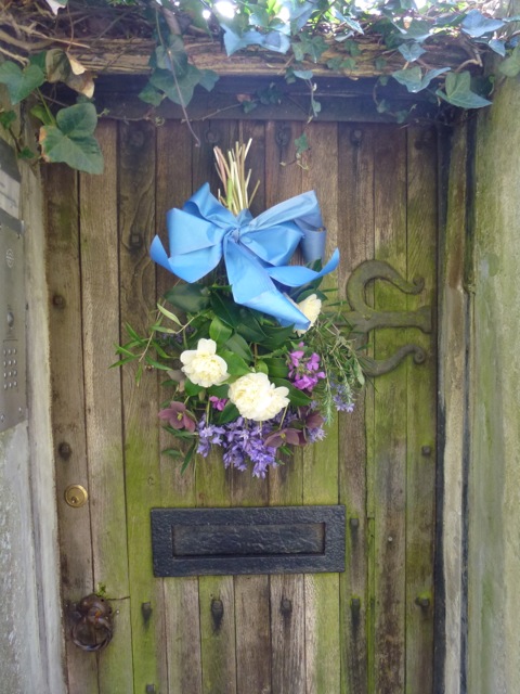 flowers hanging on rustic door