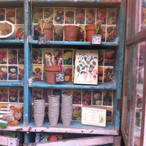 old pots on painted wooden shelves
