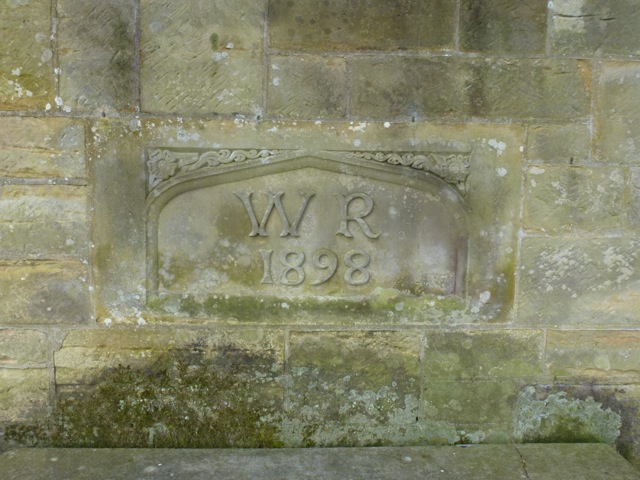 carved date and initials in the walled garden built by William Robinson 