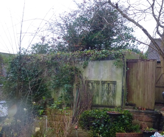 old dilapidated garage in garden