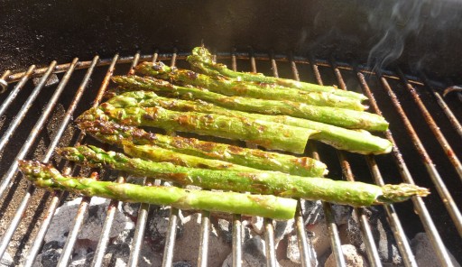 caramelised asparagus smoking on the bbq