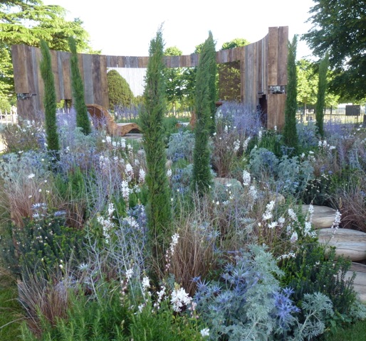 modern garden with driftwood used creatively