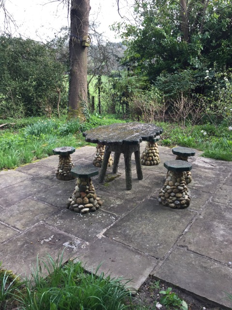 another rustic table with several stools