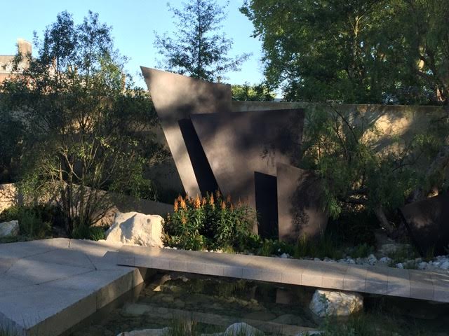 Andy Sturgeon’s dramatic Telegraph Garden where the bronze fins represent mountains within arid setting